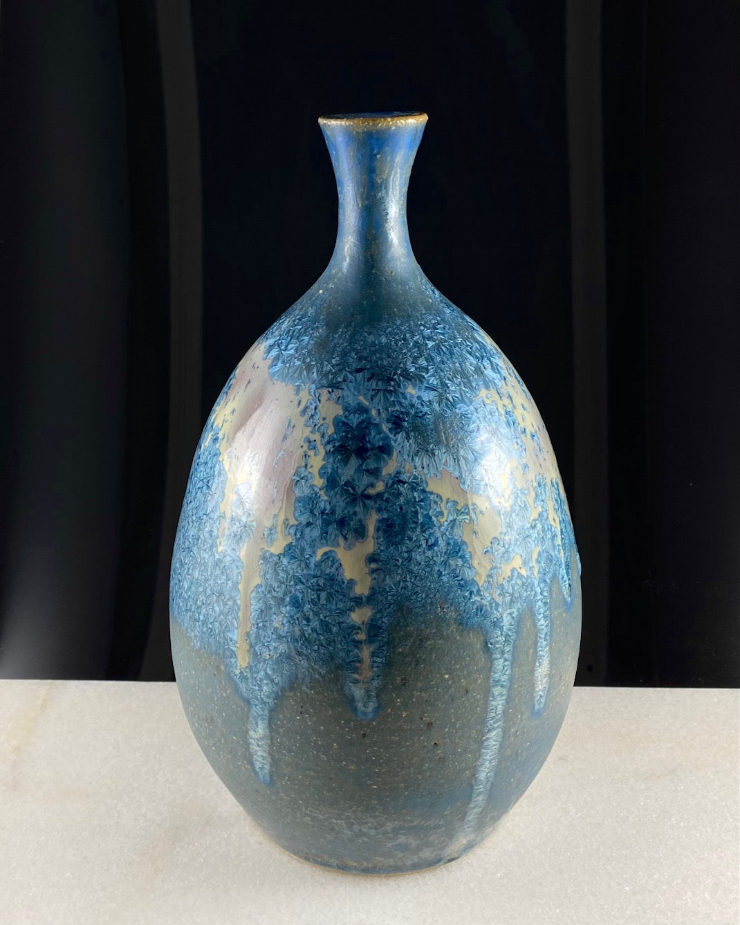 Large crystalline good vase featuring a blue glaze